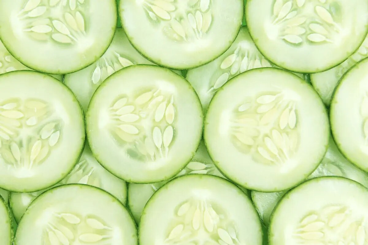 A close up shot of cucumber slices.
