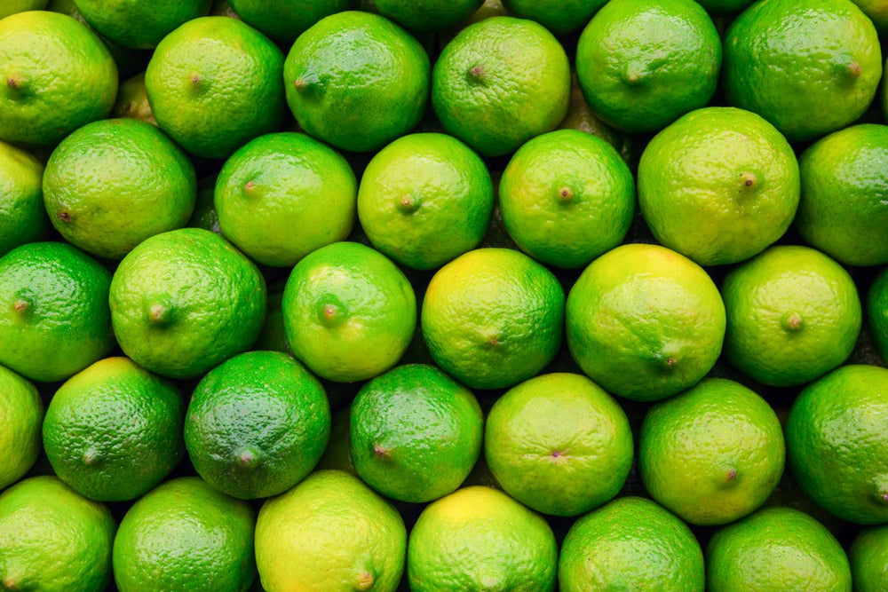 A close-up texture shot of lime fruits.