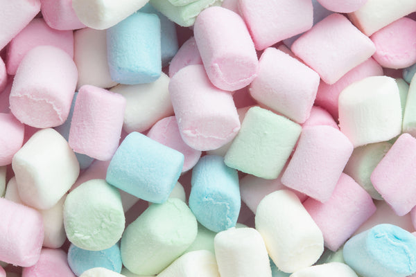 A close-up texture shot of multi-colored marshmallows.